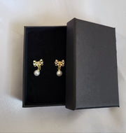 Black and gold bow pearl earrings